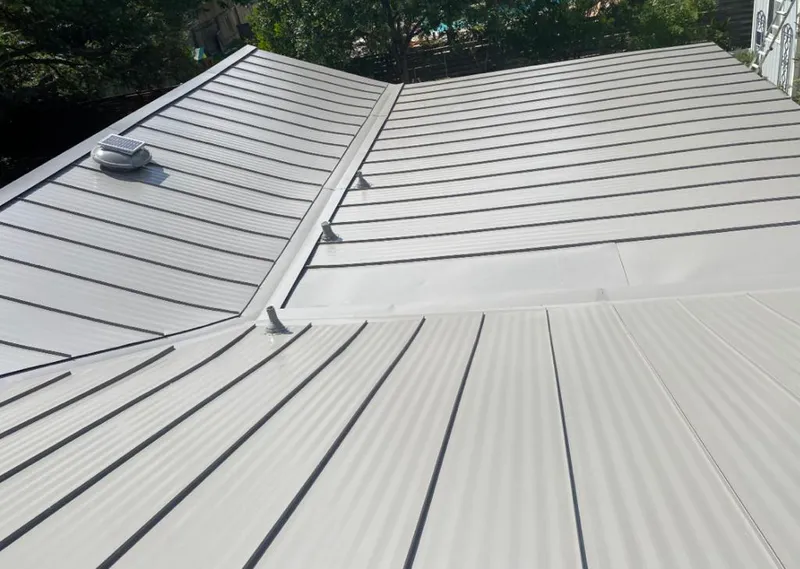Solar attic fan installed on a metal roof for Roof Ventilation in Spanish Springs